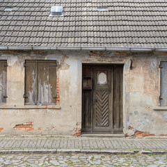 old house / Old, dilapidated house with a wooden door 