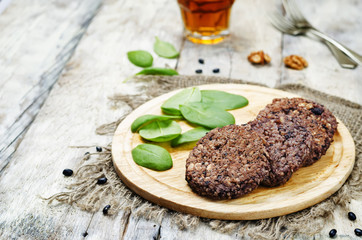 black beans brown rice walnut oat burgers with spinach