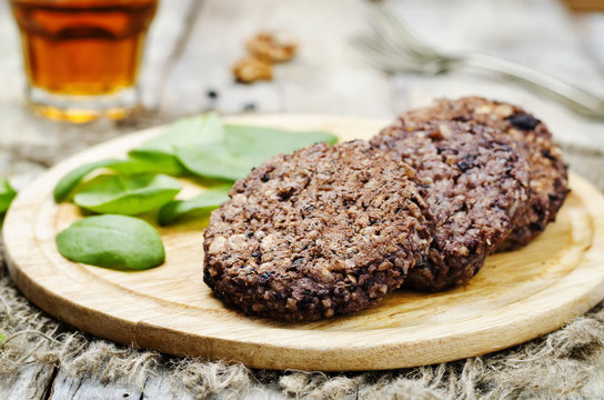 Fototapeta black beans brown rice walnut oat burgers with spinach