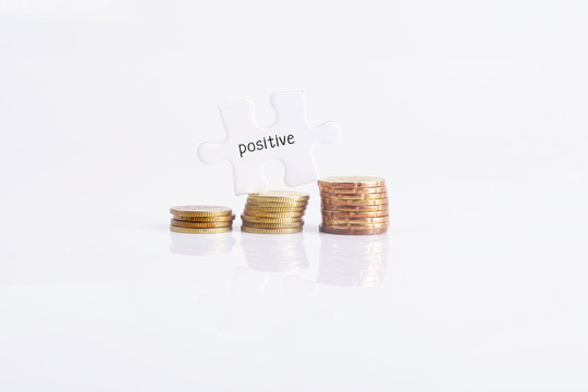 White missing puzzle and gold coins with positive word ,copyspace area