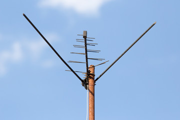 TV antenna on a background of blue sky