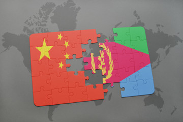 puzzle with the national flag of china and eritrea on a world map background.