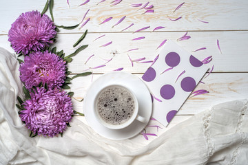 Word relax with cup of coffee and pink flowers