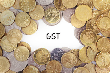 Background of the gold coin with word GST in the middle.