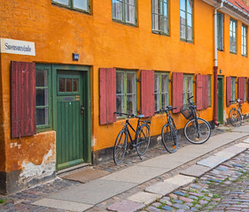 Nice old yellow houses of Nyboder, medieval district of Copenhagen, Denmark