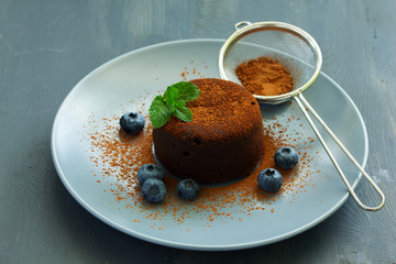 Fondant- delicious chocolate dessert with blueberries.