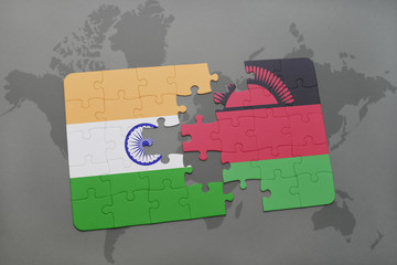 puzzle with the national flag of india and malawi on a world map background.