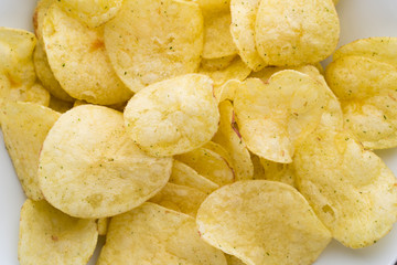 Close up potato chips on top view background.