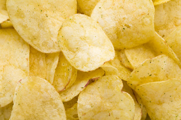 Close up potato chips on top view background.