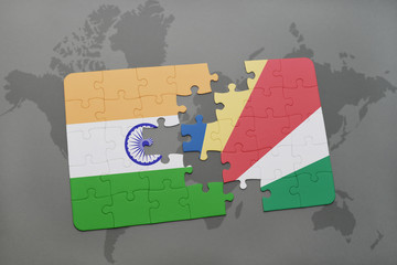 puzzle with the national flag of india and seychelles on a world map background.