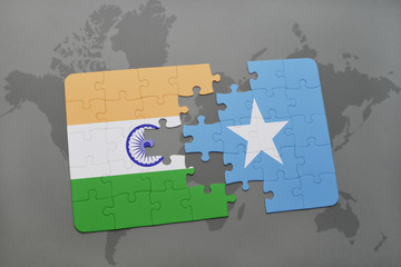 puzzle with the national flag of india and somalia on a world map background.