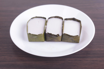 Tepung Pelita cakes with Pandan leaf on wooden background.