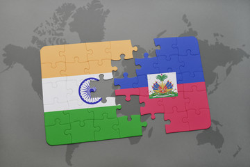 puzzle with the national flag of india and haiti on a world map background.