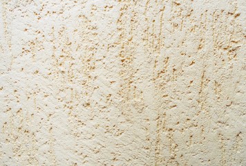 the texture of the wall, yellow plaster