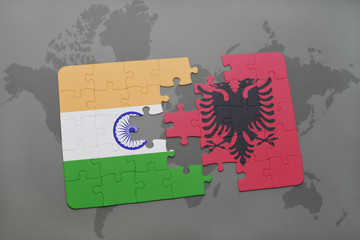 puzzle with the national flag of india and albania on a world map background.