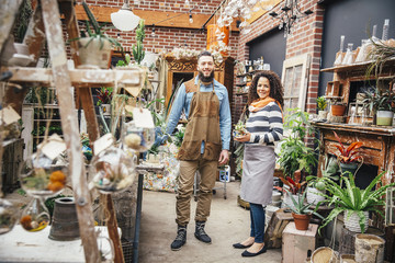 Employees smiling in plant nursery