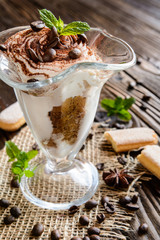 Traditional coffee Tiramisu dessert in glass jar