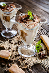 Traditional coffee Tiramisu dessert in glass jar