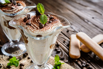 Traditional coffee Tiramisu dessert in glass jar