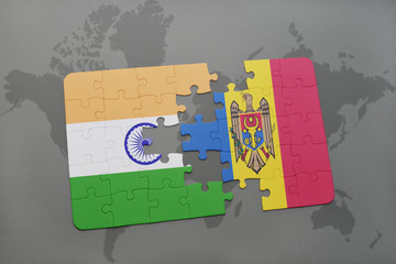 puzzle with the national flag of india and moldova on a world map background.