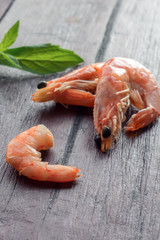 Boiled prawns on wooden backdrop. Vertical photo