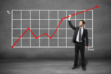 Man holding chart arrow