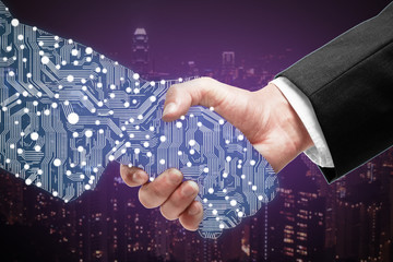Businessman shaking digital hand