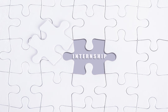 Missing white puzzle with INTERNSHIP word and copyspace area.