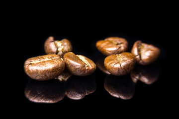 Coffee bean roasted on black reflection glass  background.