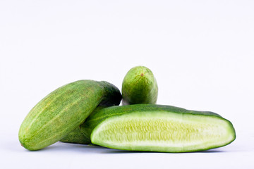 fresh green cucumber and slice of cucumber on white background healthy vegetable food isolated
