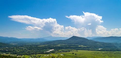 Fototapeta na wymiar Panoramic view on valley in mountains