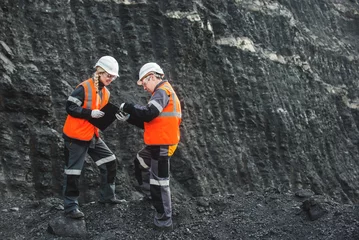 Foto op Canvas Workers with coal at open pit © agnormark