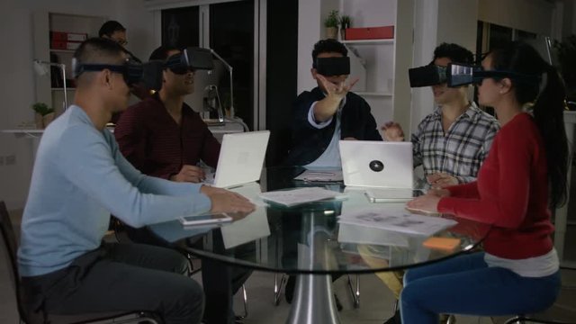  Computer programmers trying out virtual reality viewers