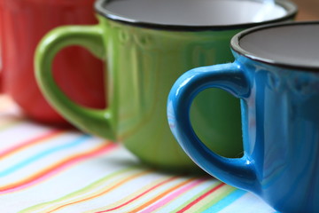 Colorful row of cappuccino cups