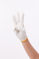 worker hand pointing up three fingers, with cotton glove