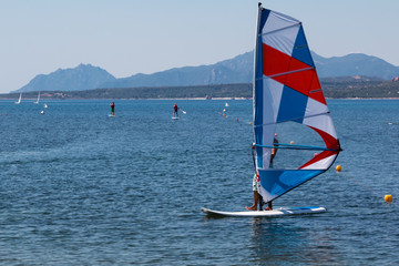 Wind Surfing in the Summer on Calm Coastal Water