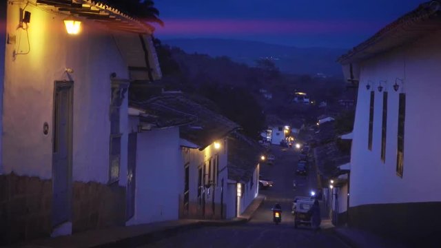 Empty streets of colonial town illuminated with warm lanterns Giron, Colombia