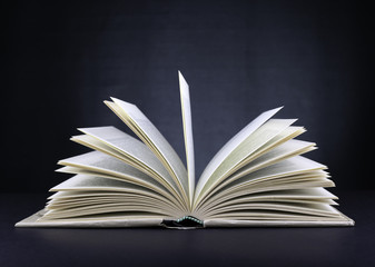 Open book on a black background