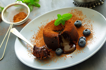 Fondant- delicious chocolate dessert with blueberries.