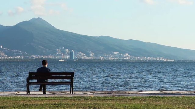 1920x1080 25 Fps. People near The Seaside Sitting and Looking Sea and Sunset landscape.