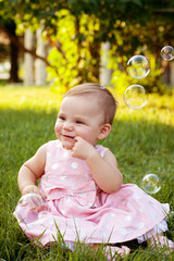 Beautiful baby with soap bubbles