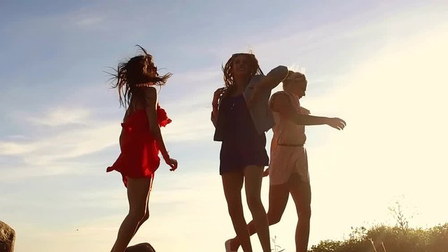 group of happy women or girls dancing on beach 53