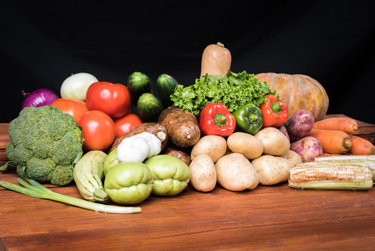 Vegetables over wooden table