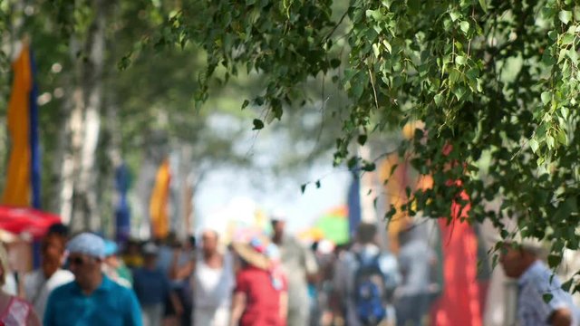 Crowd on airshow mooved on the street in outdoor, out of focus