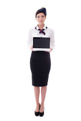 portrait of young stewardess holding laptop with blank screen is