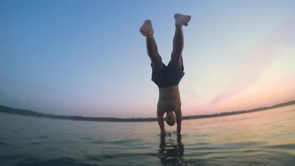 young man jumping into sea from the sail boat in slowmotion. 1920x1080 - Powered by Adobe