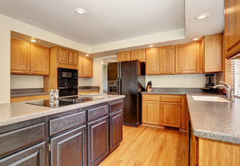 Kitchen room interior with with granite counter top and island.