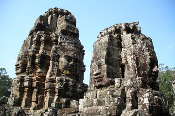 Naklejka premium April 2012, Bayon faces at Angkor Thom, Cambodia. The ancient construction related to Khmer's history and religious.