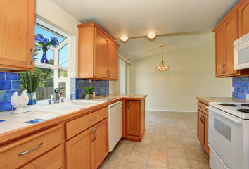 Kitchen interior. Maple cabinets and back splash trim.
