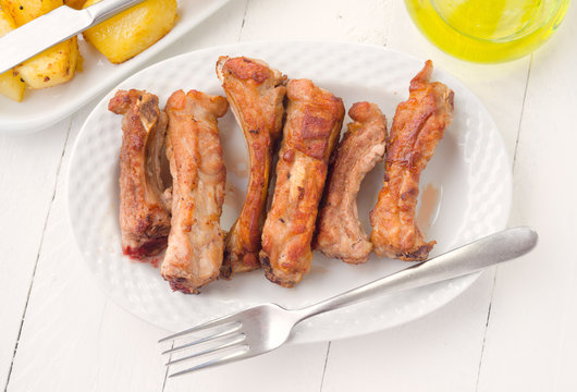 Overhead Take Fried Pork Ribs In White Tray On Wooden